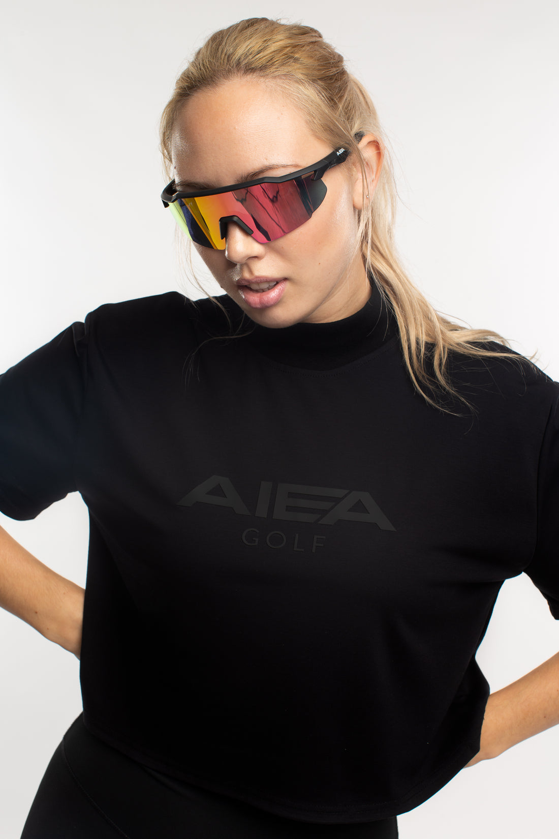 AIEA Golf cropped mock neck logo tee in black